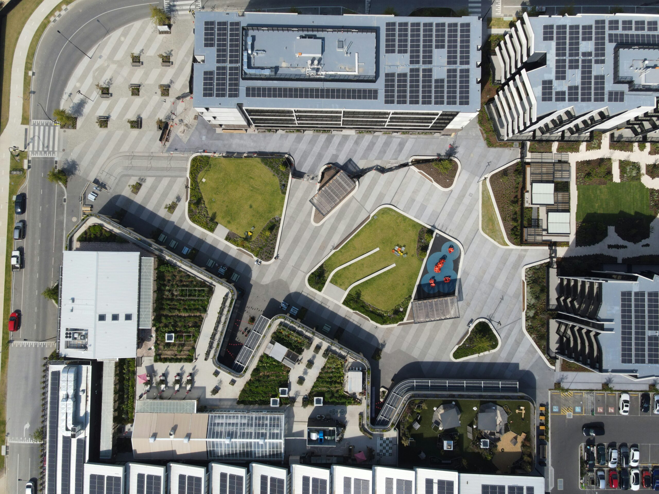 An Aerial View Of A Parking Lot And Parking Garages